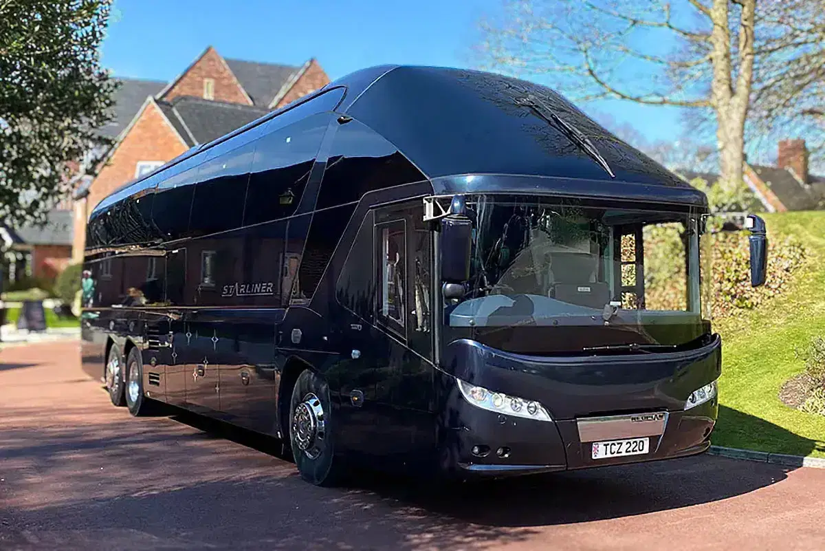 black executive coach hire manchester. Starliner coach driver side.