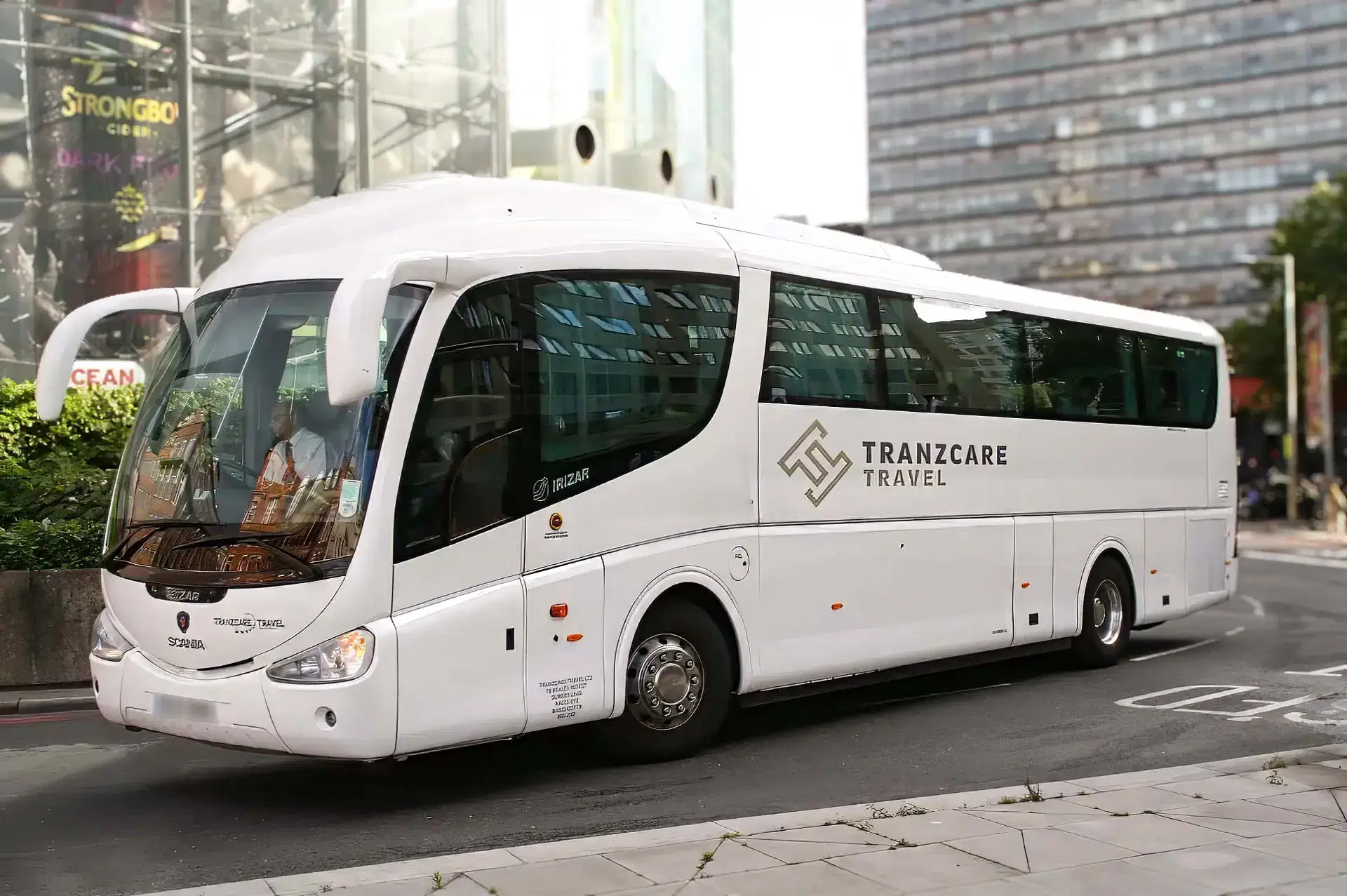 Front view of a 57-seater Tranzcare large coach built on a modern, low-emission Euro 6 compliant chassis. A pristine Tranzcare high-capacity coach ready for school charter or university sports team transit in the North West.