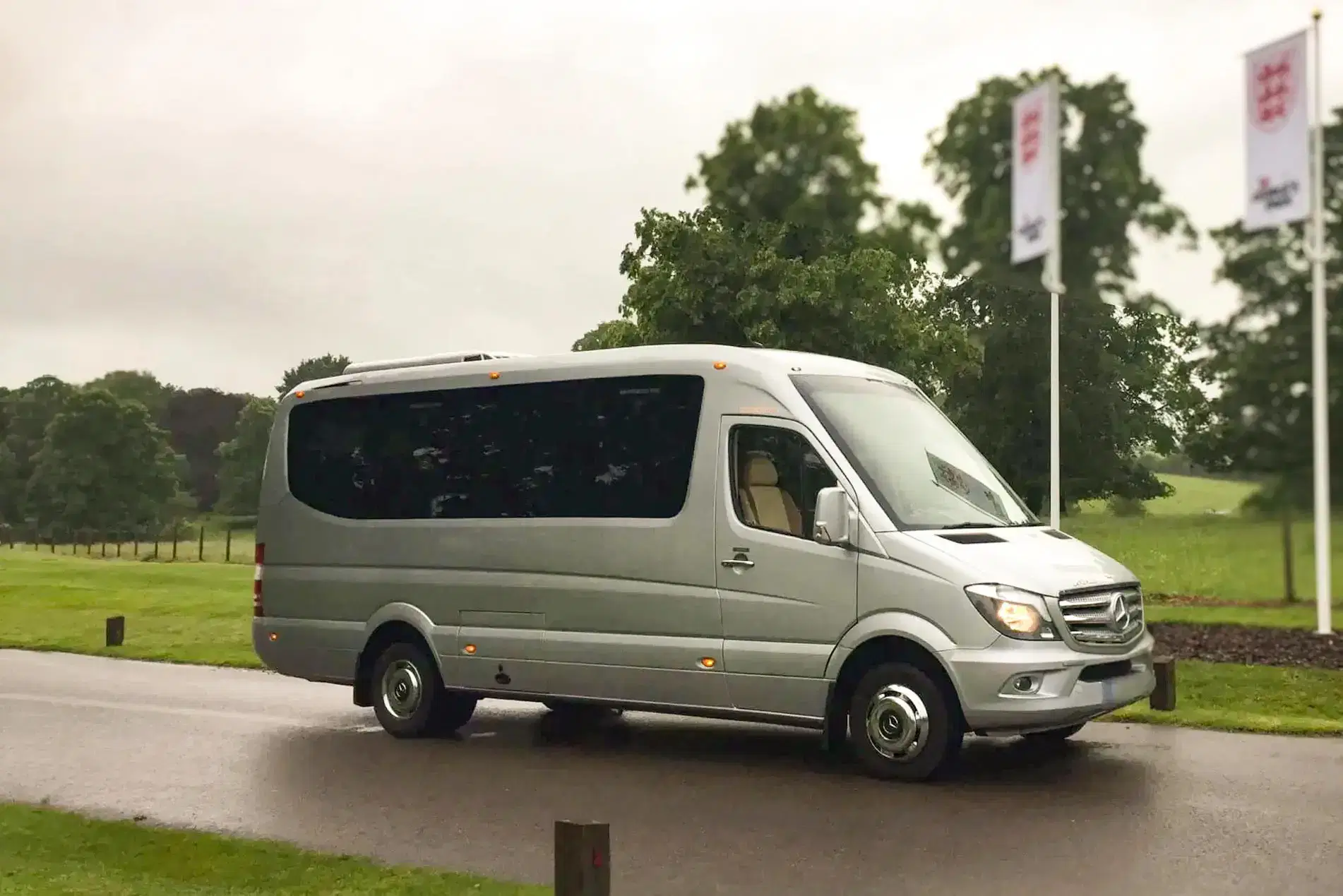 A pristine Tranzcare executive midi coach ready for deployment on a North West private tour itinerary.