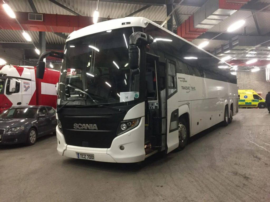 Front view of a 57-seater Tranzcare large coach built on a modern, low-emission Euro 6 compliant chassis.