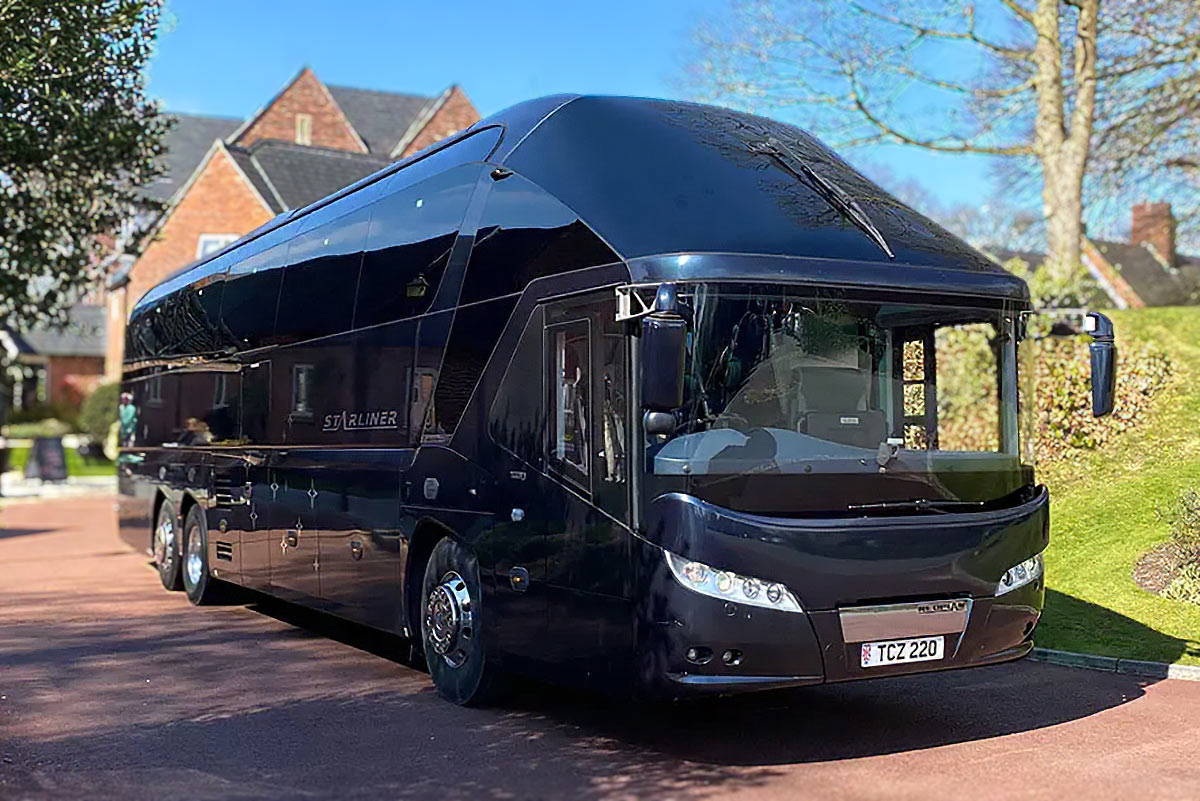 black executive coach hire manchester. Starliner coach driver side.