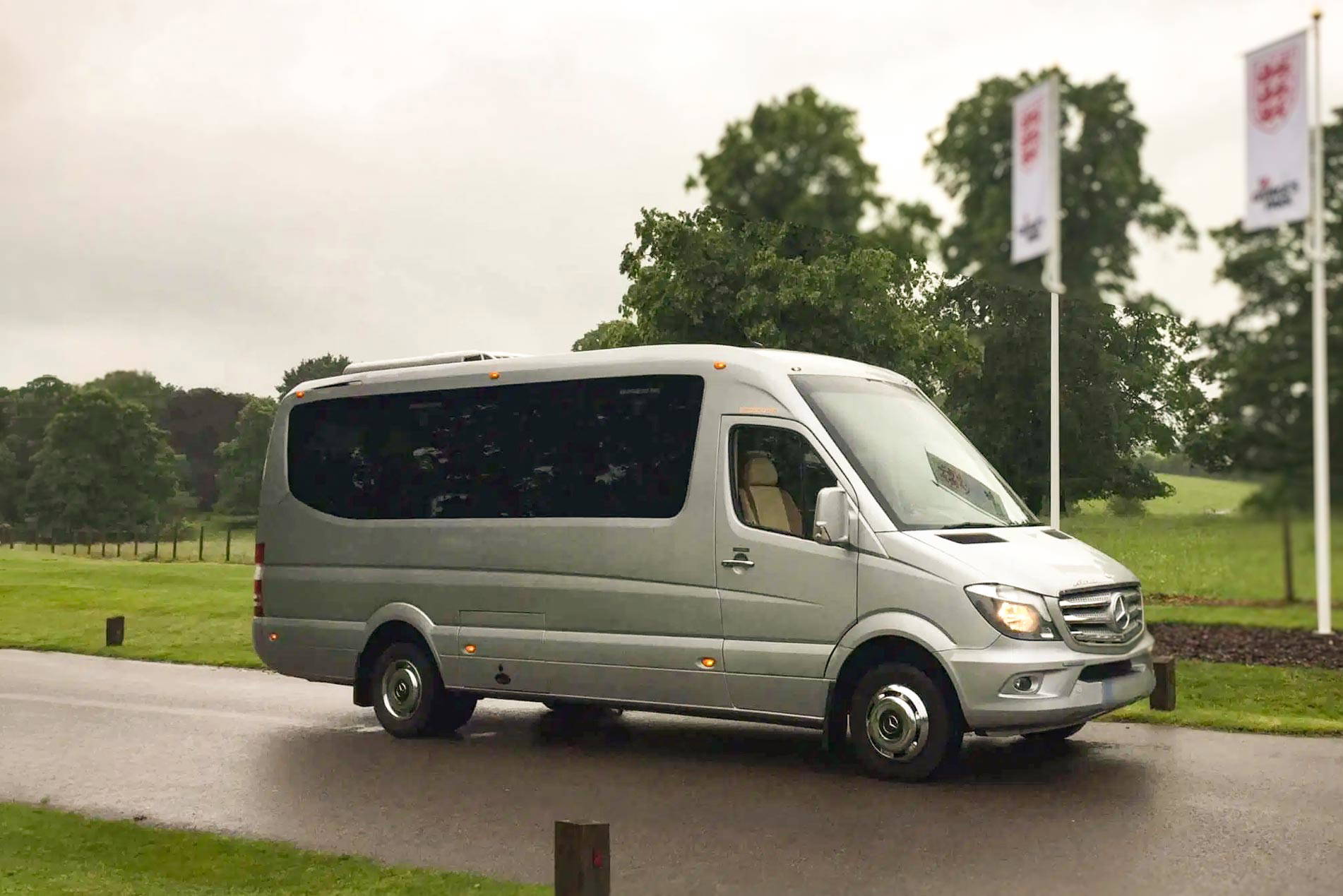 A pristine Tranzcare executive midi coach ready for deployment on a North West private tour itinerary.